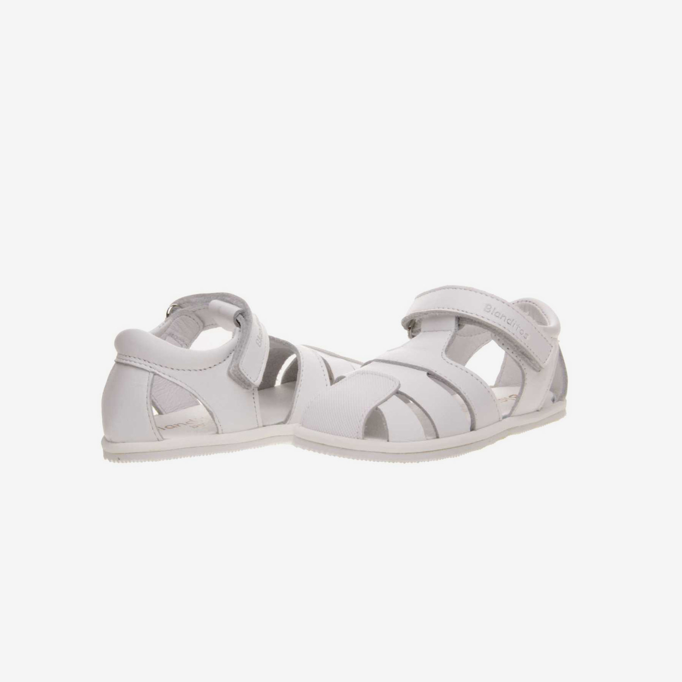 Sandalia respetuosa en color blanco con velcro.