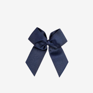 Lazo azul marino de Condor de grosgrain para niña con pinza. Sujeta sin tirar, combina con todo y aporta un toque clásico. Ideal para el día a día o eventos especiales.