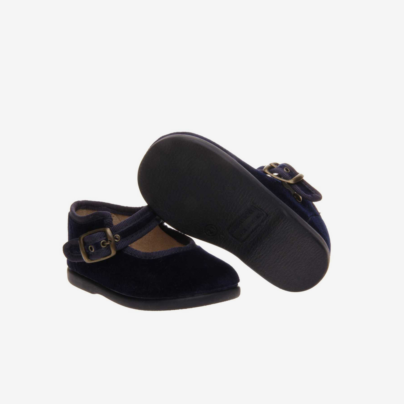 Mercedes de niña en serraje azul con hebilla.