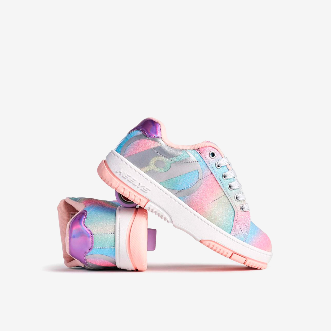 Heelys arcoíris para niña, con ruedas desmontables y diseño brillante. Comodidad, estilo y diversión que acompañan cada movimiento.