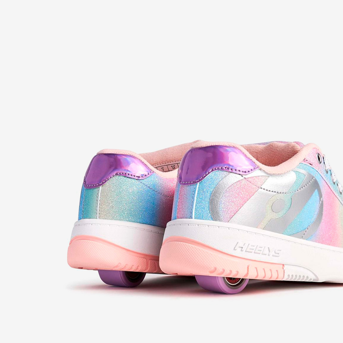 Heelys arcoíris para niña, con ruedas desmontables y diseño brillante. Comodidad, estilo y diversión que acompañan cada movimiento.