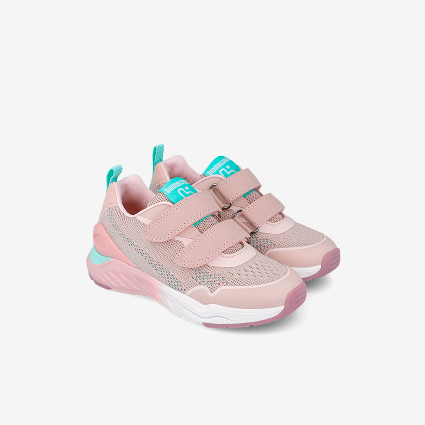 Deportiva rosa con puntera de goma y doble velcro.